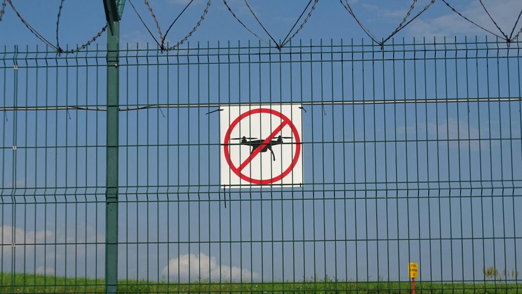 A 'No Drones' sign on a barbed wire fence in Morawica, Poland.
